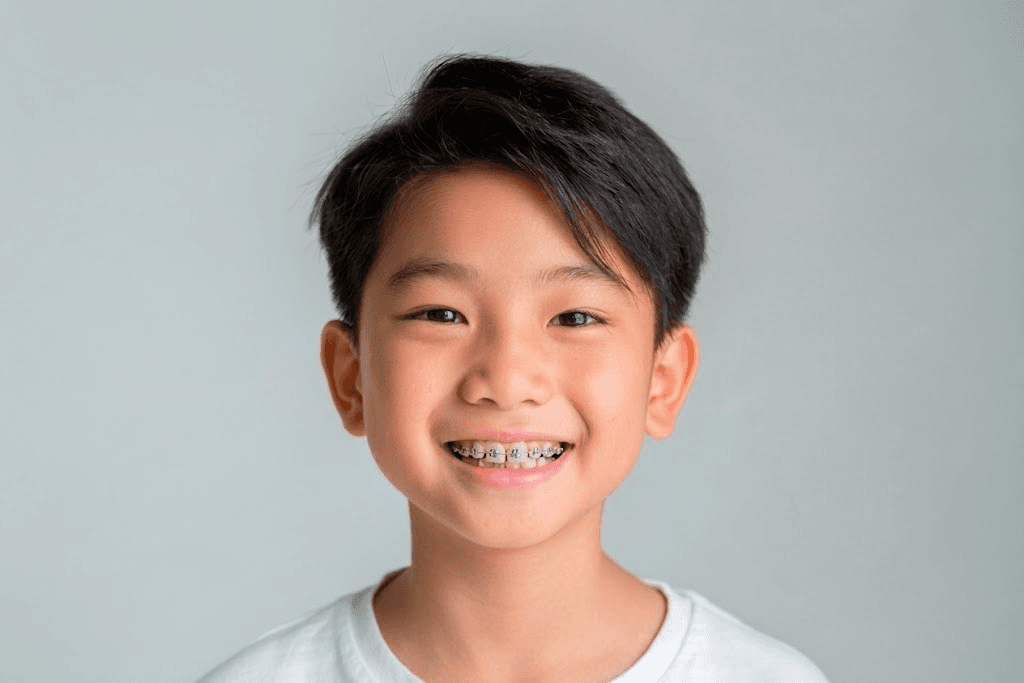 A smiling boy wearing braces