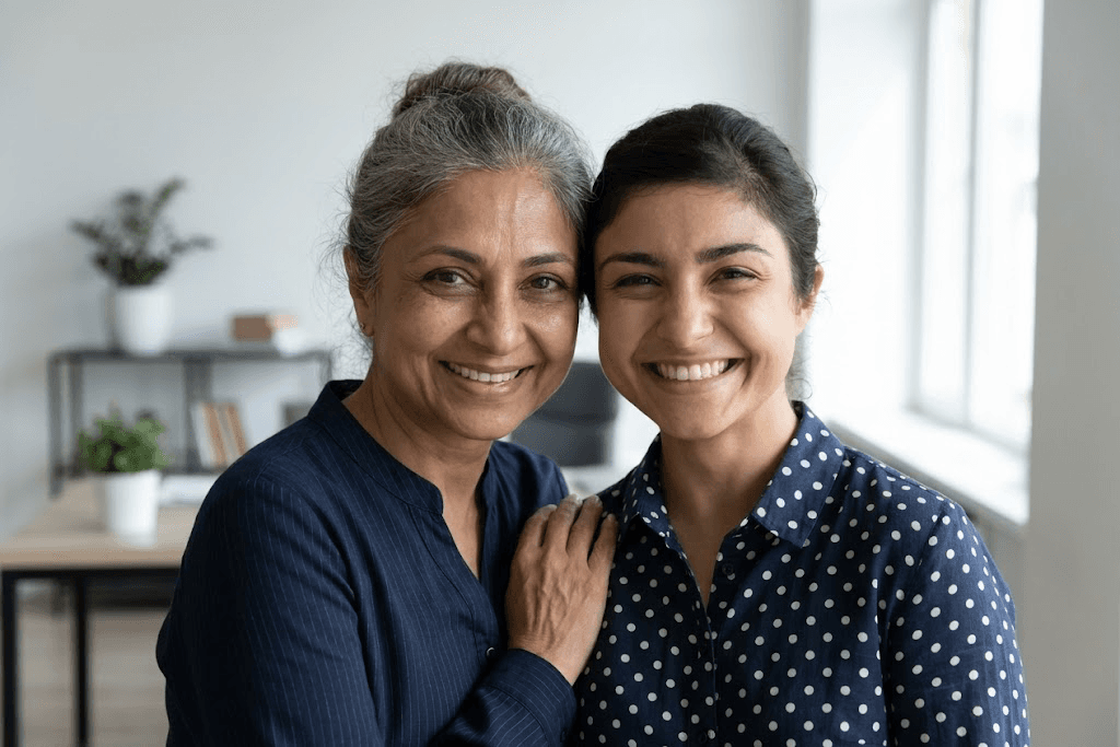 Two adult women smiling together
